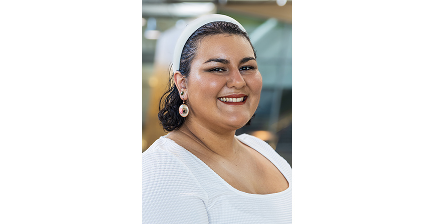 female with brown hair and white shirt